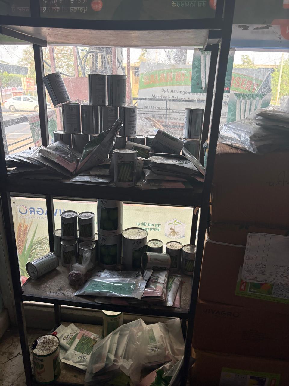 Shelf with seed packets and cans